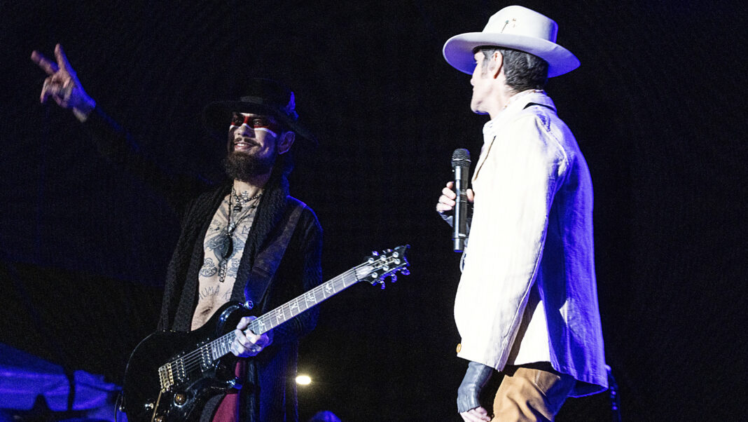 RALEIGH, NORTH CAROLINA - SEPTEMBER 03: Guitarist Dave Navarro (L) and singer Perry Farrell of Jane's Addiction perform at Red Hat Amphitheater on September 03, 2024 in Raleigh, North Carolina. (Photo by Jeff Hahne/Getty Images)